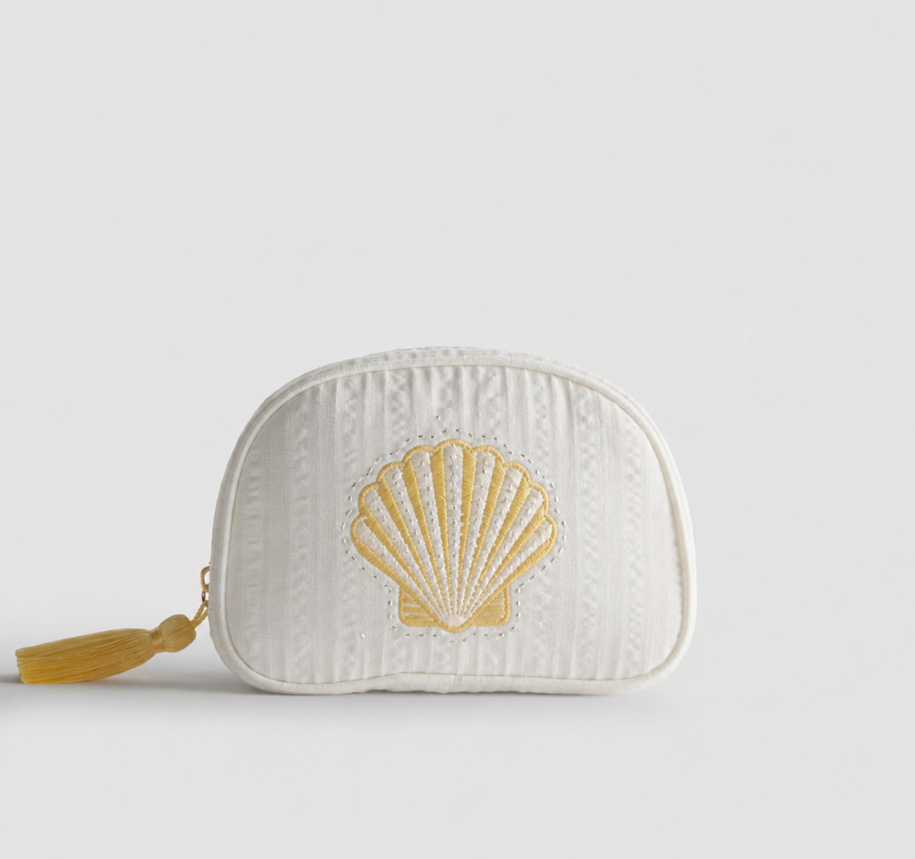 Embroidered shell cosmetic bag developed by Myo